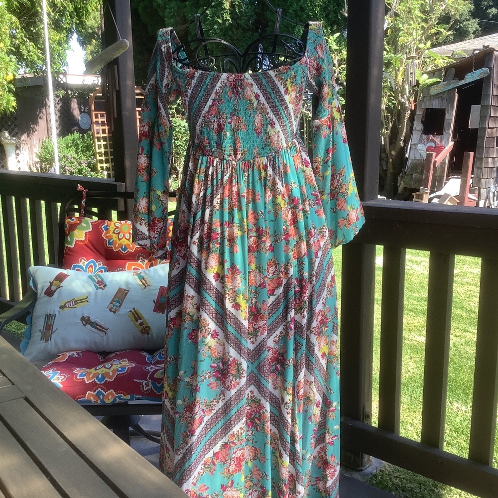 Torrid, turquoise hot pink, and yellow roses pattern dress with gathered bodice.